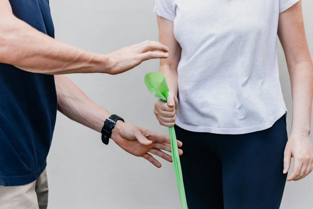 Physiotherapist guiding a rehabilitation exercise session